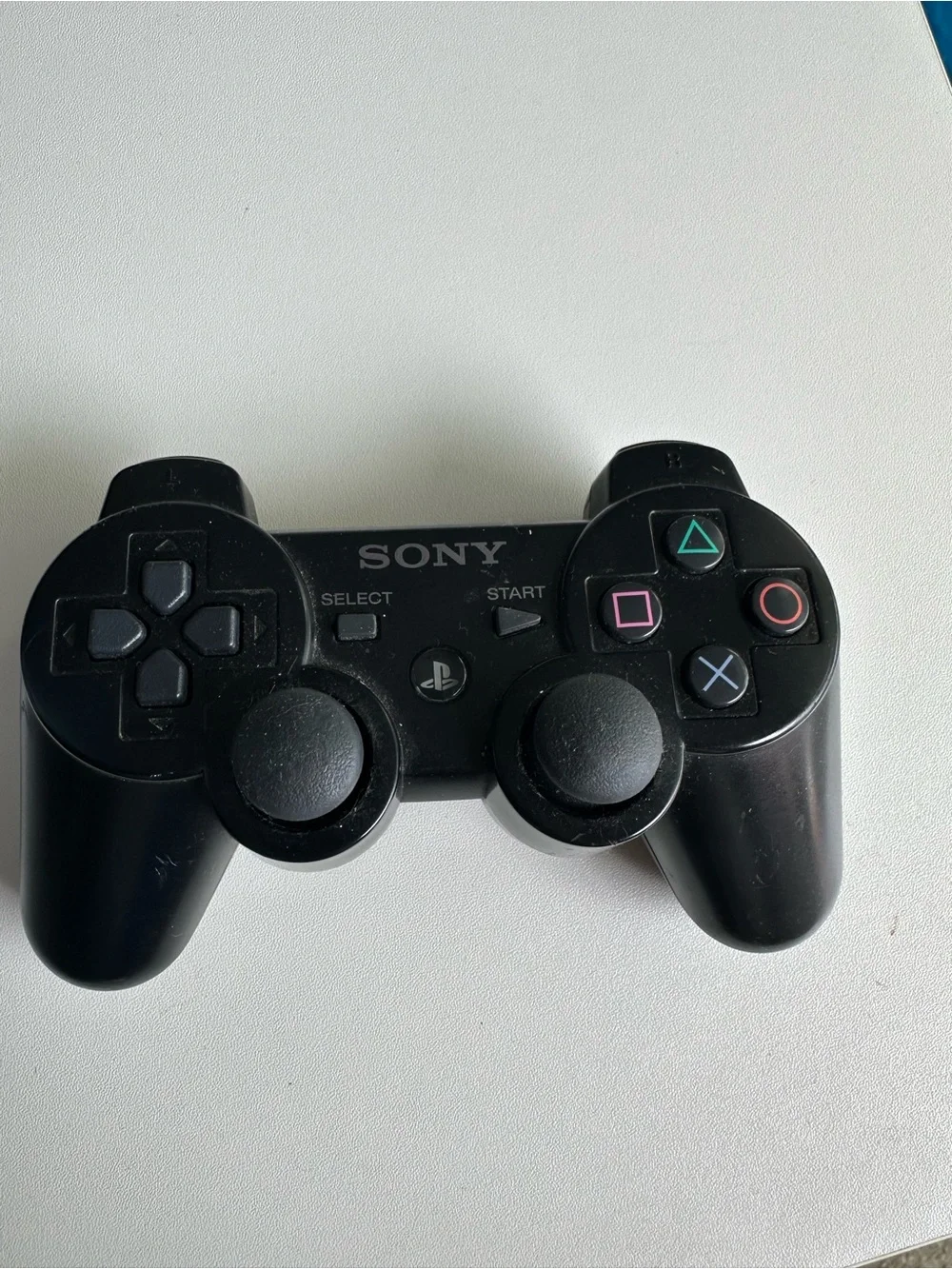 Sony Black PlayStation Controller with Colored Face Buttons